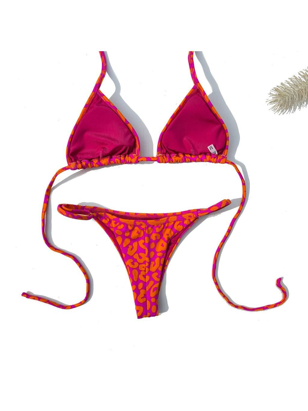 Dolce bikini laid flat, in pink and orange