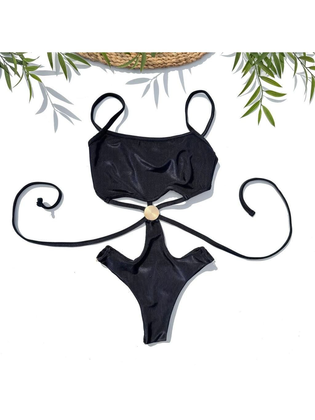 Élite one-piece laid flat, in black