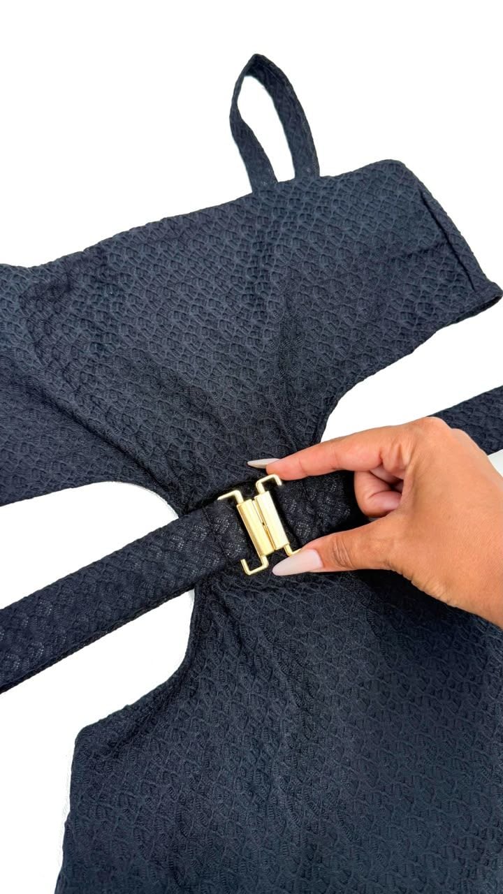 Close-up of the Royale one-piece in black