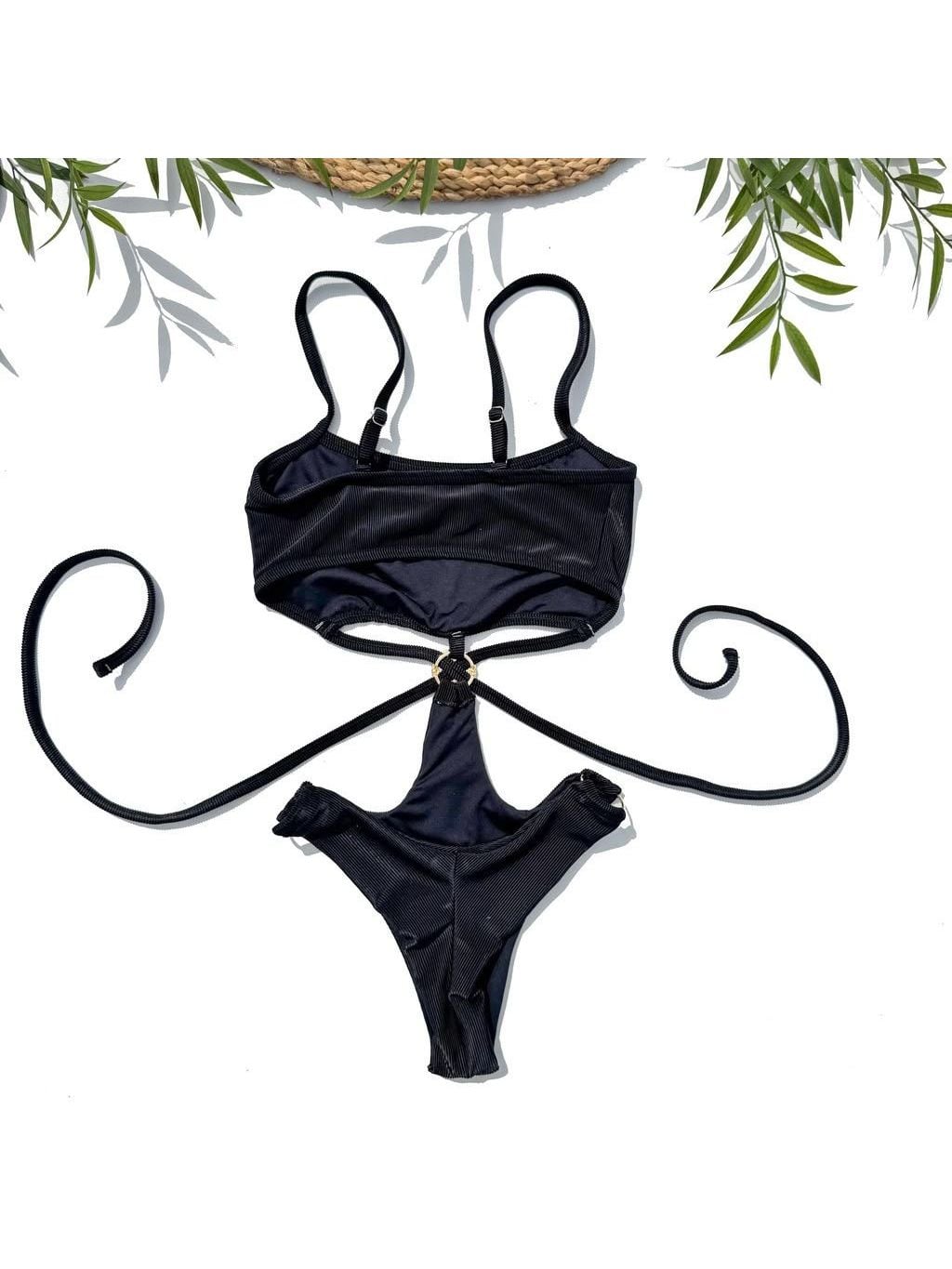 Élite one-piece laid flat, in black