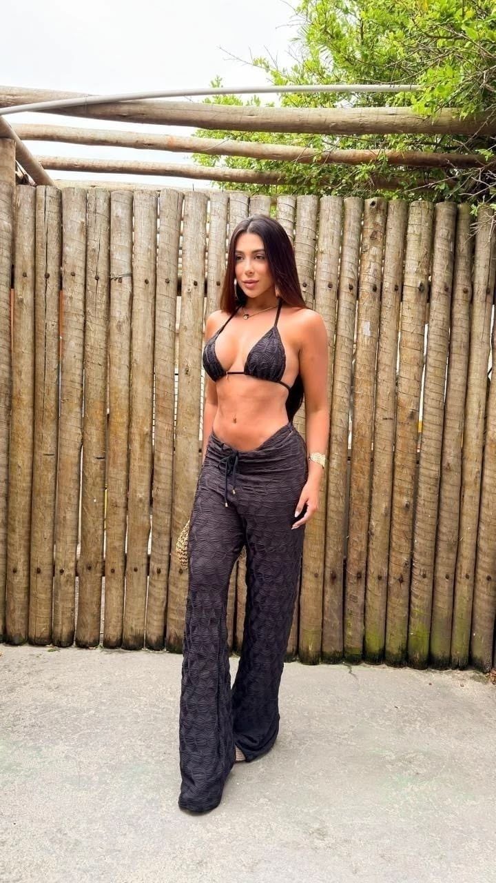 Model wearing the Noir beach pants from the St. Tropez collection