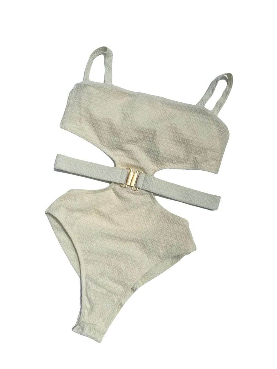 Riviera one-piece laid flat, in off-white