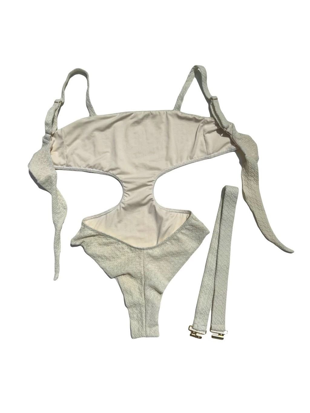 Riviera one-piece laid flat, in off-white